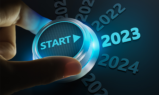 Hand switching a start button from 2022 to 2023.