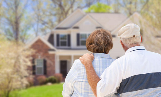 older couple looking at house