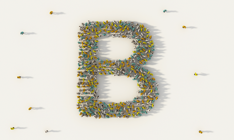 Birdseye view of people coming together to form the letter B