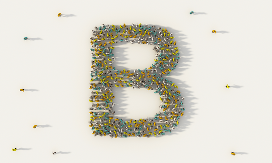 Birdseye view of people coming together to form the letter B