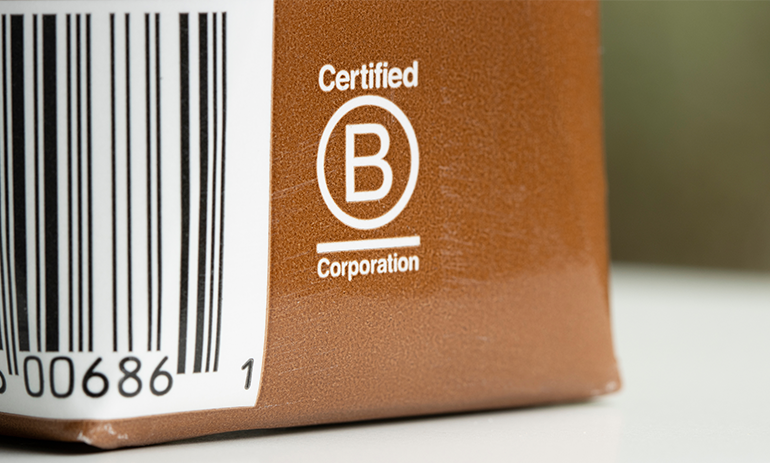 B corp logo on brown box|