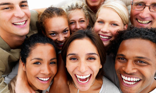 close up of faces of group of people standing together