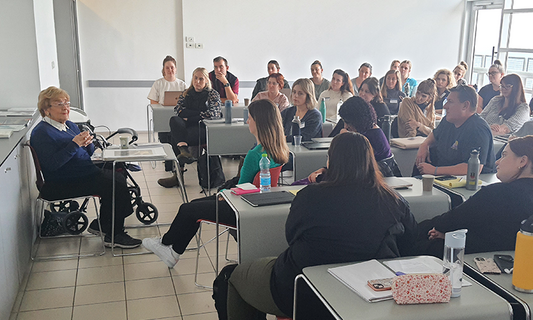 Gandel Holocaust Program participants listening to the testimony of Holocaust survivor Rena Quint during their seminar at Yad Vashem, Israel, in January 2023.