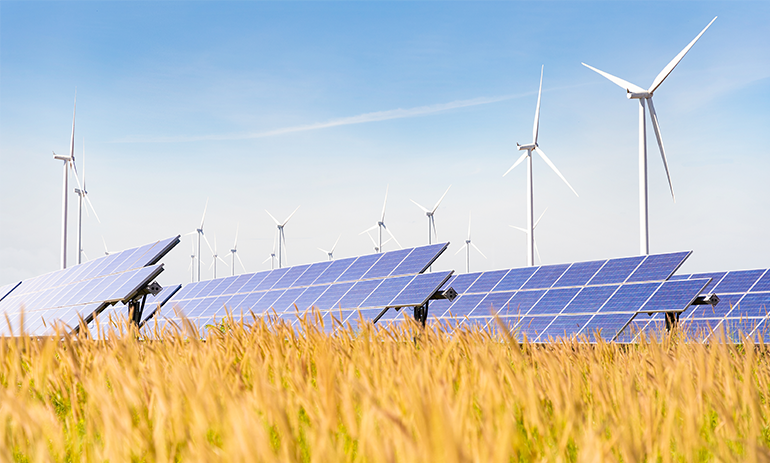 solar and wind farms in field