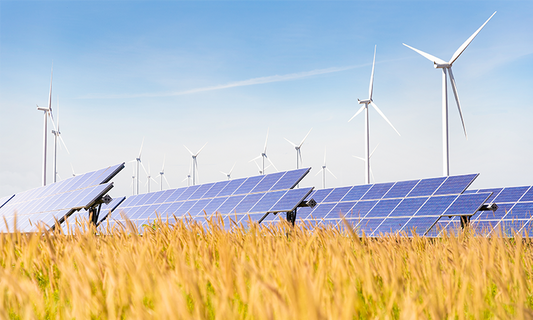 solar and wind farms in field