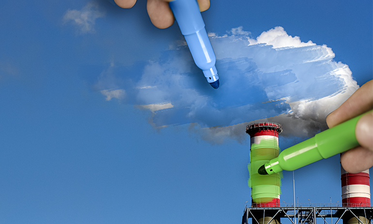 Two hands colouring over a polluting factory in green to represent greenwashing.