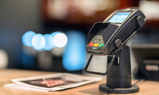 card machine on a shop counter
