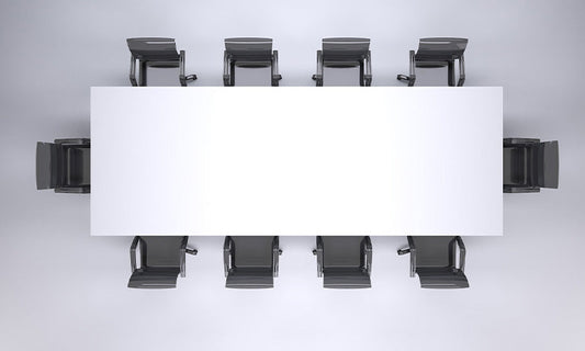 We're looking down at a boardroom table, with ten black chairs around a white rectangular table.