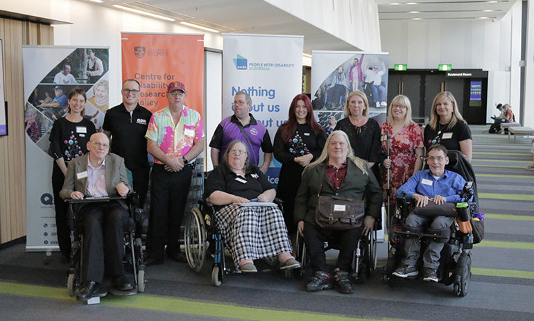 A group of people, some with visible disabilities, arrive at the QDN lunch at the Asia-Pacific Ministerial Conference on Disaster Risk Reduction.
