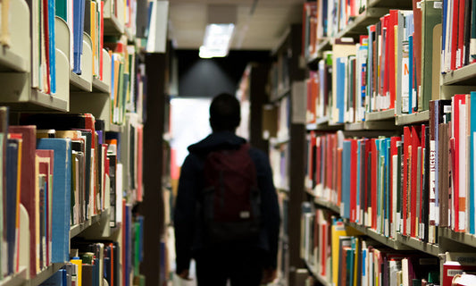 A person walks through a library