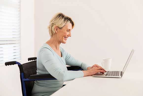 Disabled woman on laptop
