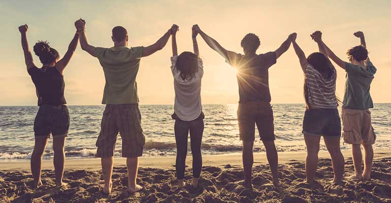 Young people holding hands