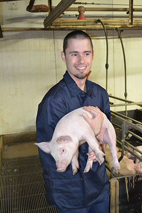 Zach Zaborny with pig 