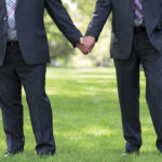 Business men holding hands