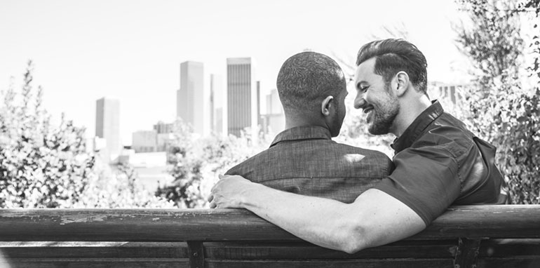 Gay couple sitting on a bench