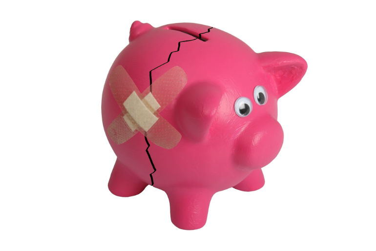 broken piggy bank with a band-aid