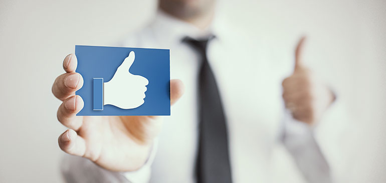 Man thumbs up with Facebook icon