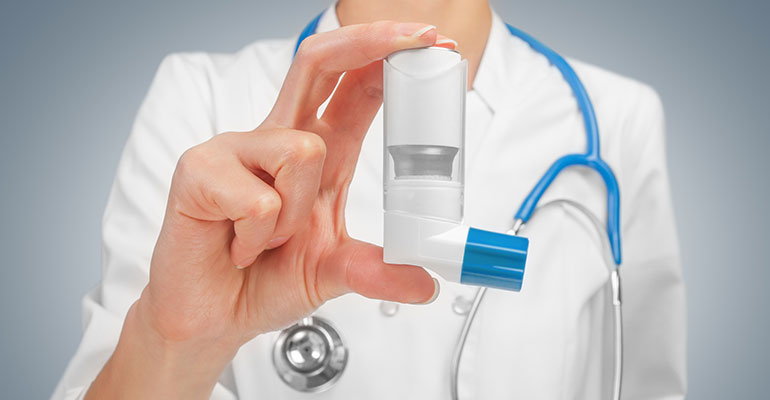 Doctor holding an inhaler