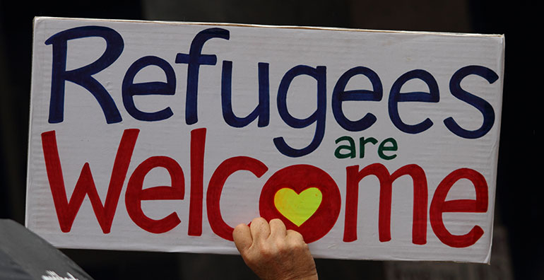 refugee welcome sign