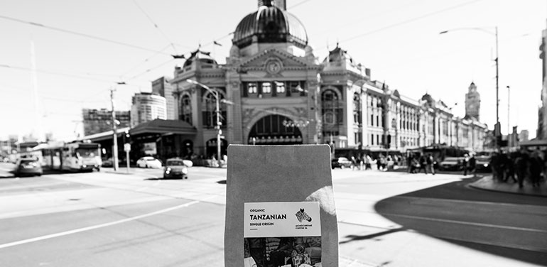 Packet of coffee in front of Flinders Street station