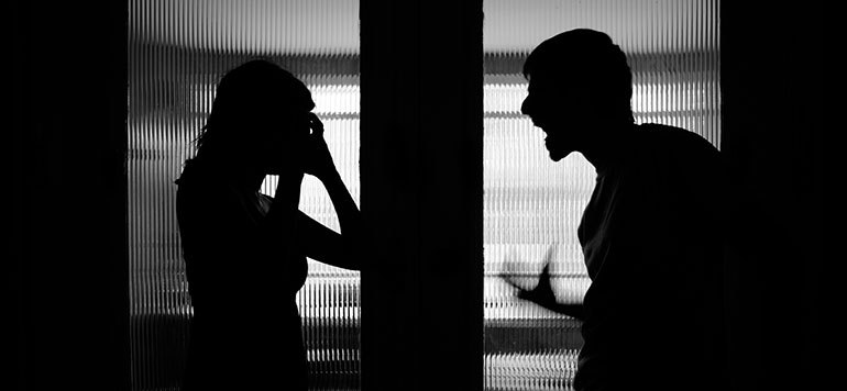 silhouette of couple fighting
