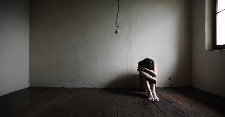 distressed woman in empty room