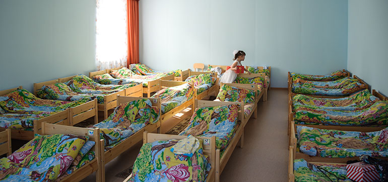 dormitory filled with beds in an orphanage