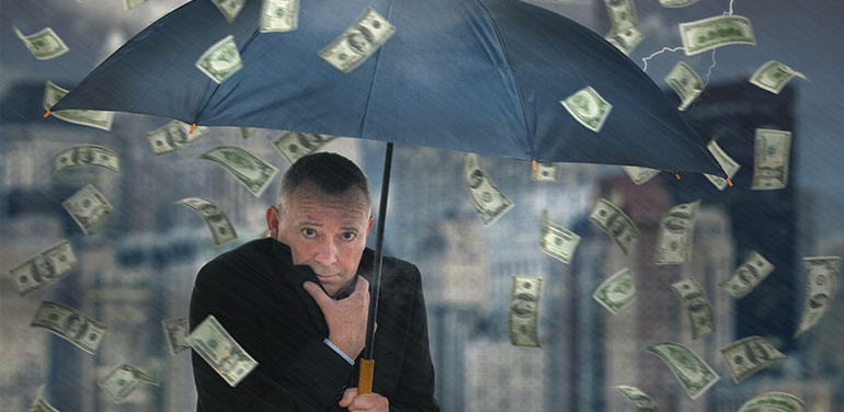 man standing under umbrella with sky raining money