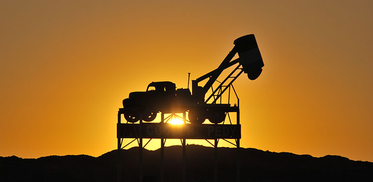 mining equipment against sunset