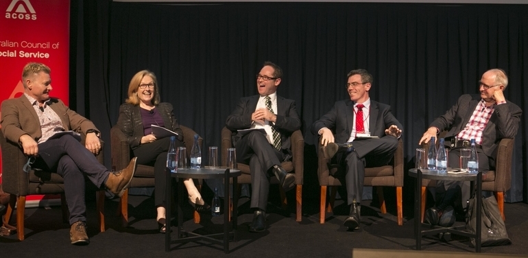 Panel at ACOSS conference laughing