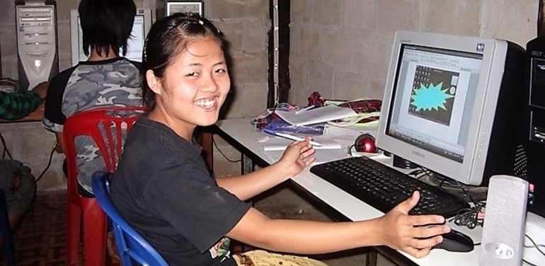 Karen refugee in Mae La refugee camp in Thailand using discounted computer