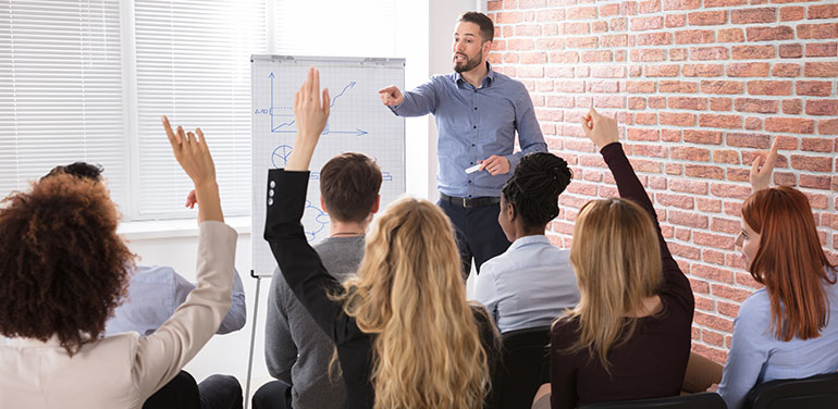 Man giving lecture to group of people