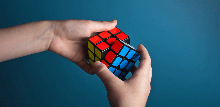Person doing a rubiks cube