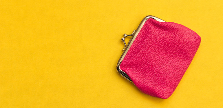 pink purse on yellow background