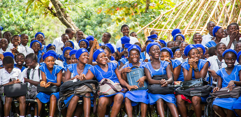 group of school children in Africa wearing blue uniforms