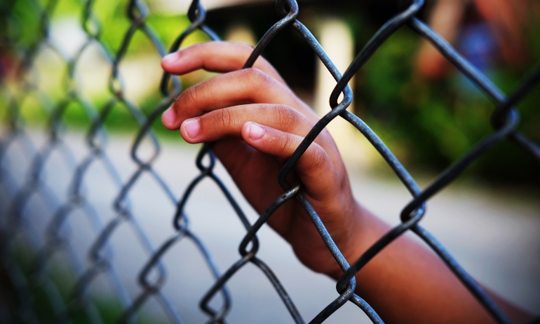 Child hand in prison