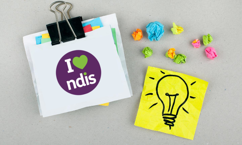 I love NDIS logo on a piece of paper in a paperclip with a postit with a drawing of a lightbulb