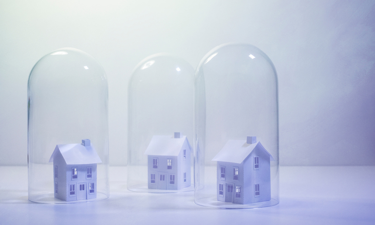 three model houses under glass domes