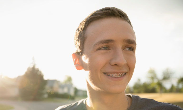 Close up of a teenage boy smiling