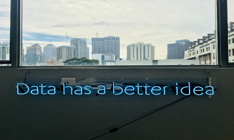 The words "Data has a better idea" with city skyline in the background