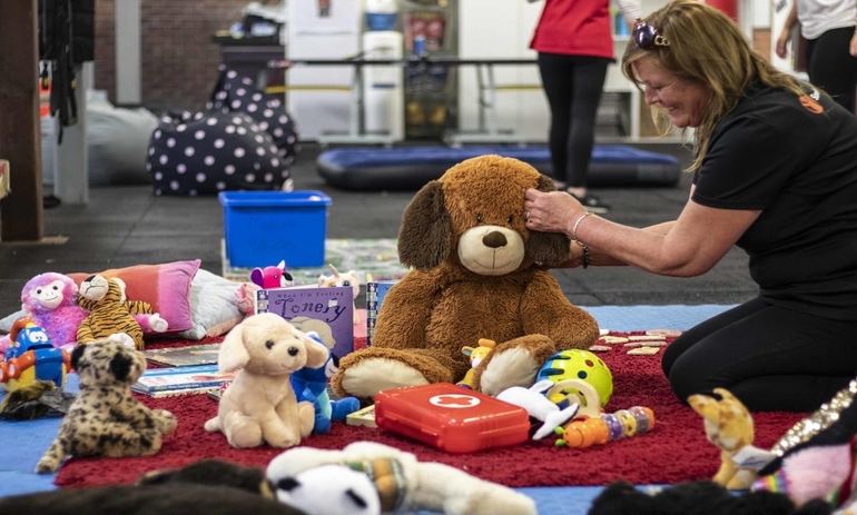 Save the Children staff setting up a child friendly space in the Bairnsdale evacuation centre.