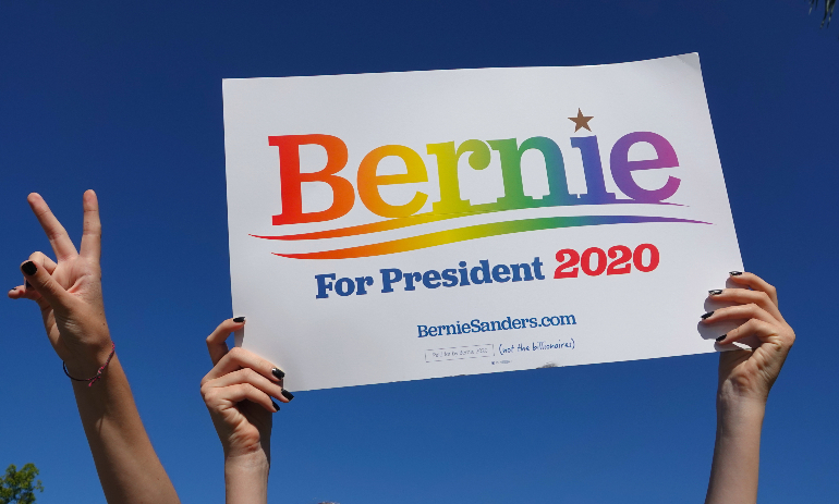 Person holding Bernie Sanders sign