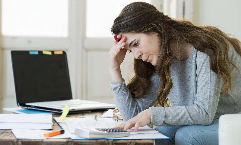 Woman stressed about paying bills