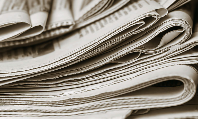 close up of a pile of newspapers