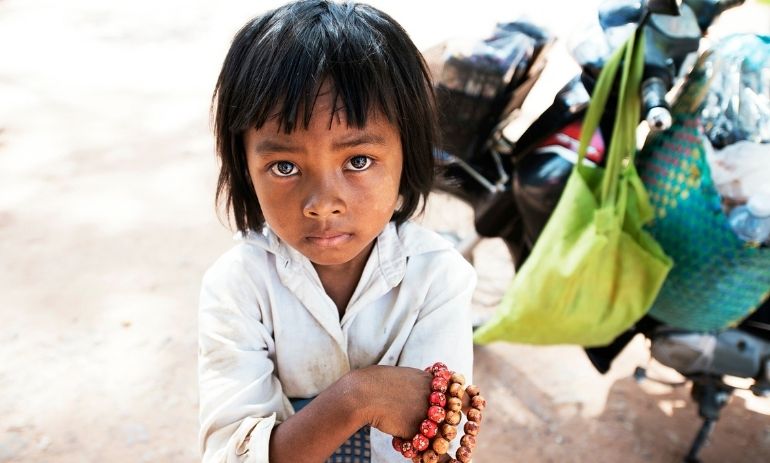 young girl holding bracelets