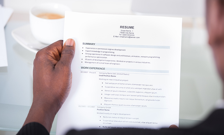 person holding resume