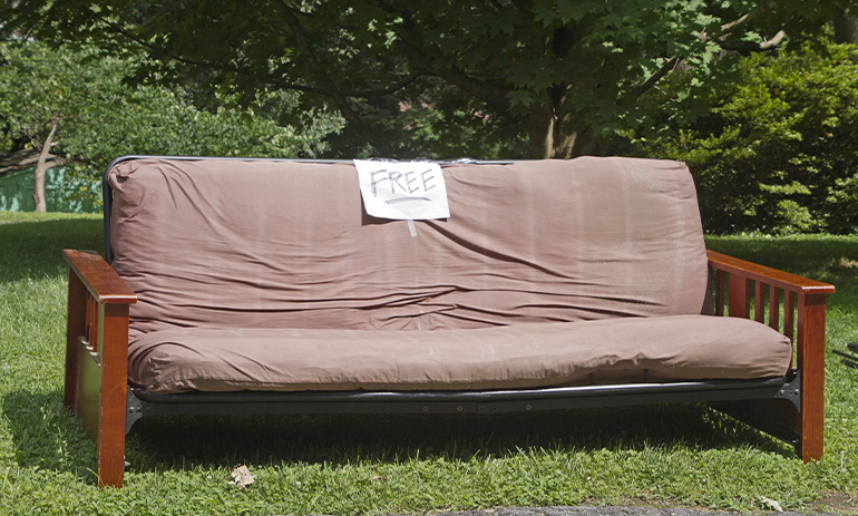 couch with sign saying free