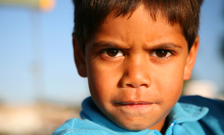 close up image of the face of a Aboriginal boy
