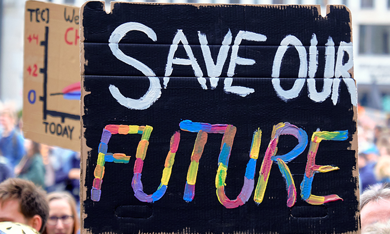 close up on a banner saying "Save Our Future"