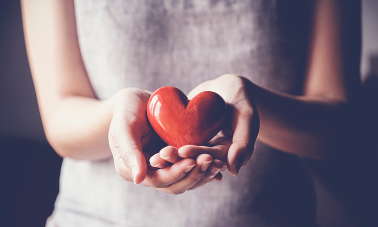 woman holding heart